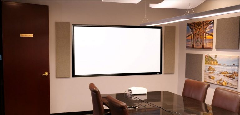 Projection screen for presentations and meetings in a modern conference room.