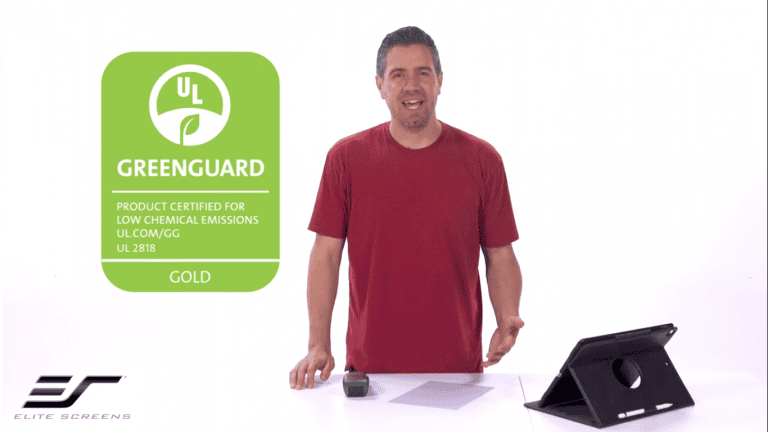 Image of a man with a tablet and projection screen, highlighting eco-friendly, GREENGUARD® certified.