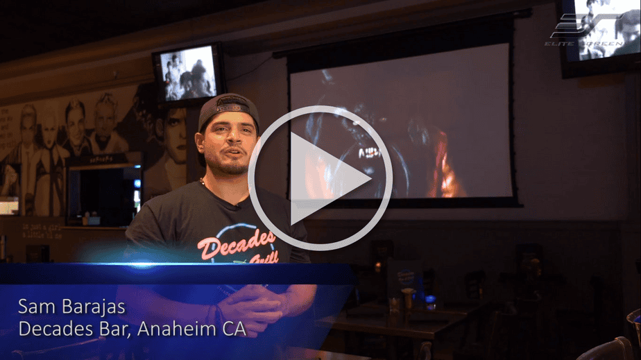 Spectrum Tab-Tension 2 electric projector screen in a home theater setup.