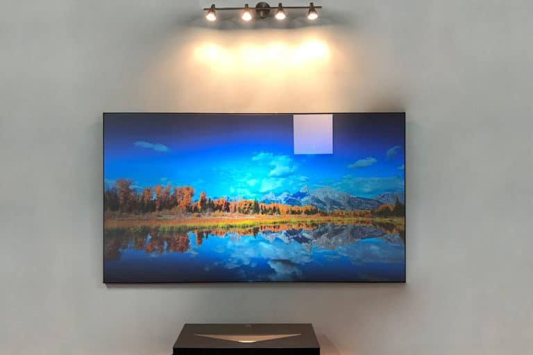 Projection screen showcasing a vibrant landscape scene for home theater or presentation use.