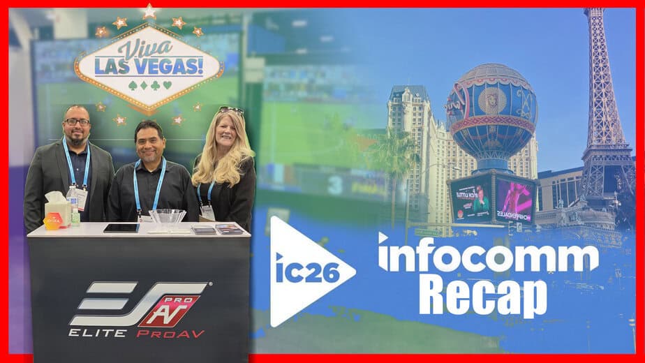 Group of three people at a conference booth with Las Vegas background.