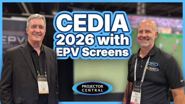 Two men at CEDIA 2026 event showcasing projection screens for home theaters.